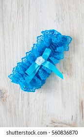 Blue Garter On Wooden Surface