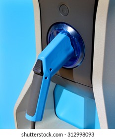 Blue gas pump machine and fuel gun - Shutterstock ID 312998093