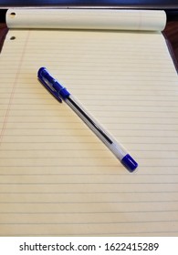 Blue Gel Ink Pen On Yellow Legal Pad Paper In Carrollton TX On January 21, 2020