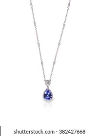 Blue Gemstone And Diamond Pendant Necklace Isolated On A White Background With A Reflection