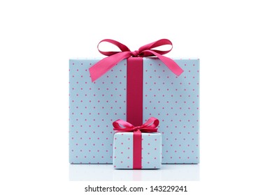 blue gift box on white background. Different sizes of the same shape gift box. A small gift box with a big gift box.  - Powered by Shutterstock