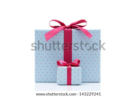 blue gift box on white background. Different sizes of the same shape gift box. A small gift box with a big gift box. 