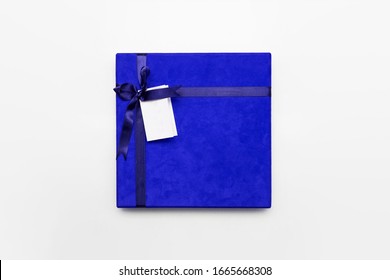 Blue Gift Box With Ribbon  And Name Tag Isolated On White Background.High Resolution Photo.