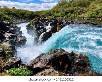 Blue glacier water at Bruarfoss Waterfall in Southern Iceland