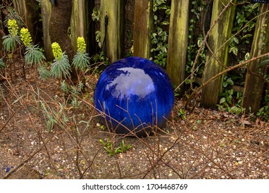 Blue Glass Sphere On Pebble Road