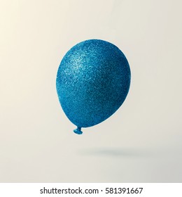 Blue Glitter Balloon On Bright Background. Creative Minimal Concept.