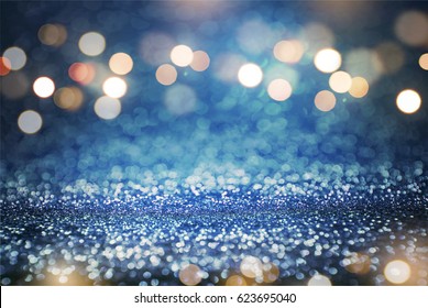 Blue glitter and gold lights bokeh abstract background. defocused, holiday concept