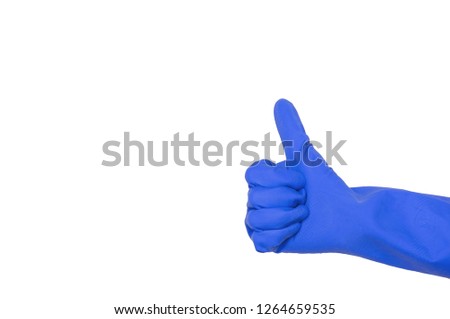 Blue glove for cleaning on a female hand shows thumb up. The concept of cleanliness.