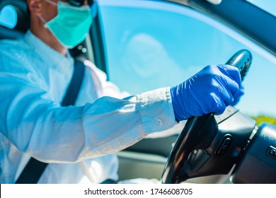 Blue gloves hands driving car. Person wearing medic protective kit. Busy driver holding wheel, summer tourist vacation, shopping delivering logistic concept. Preventive infection containment. Closeup - Shutterstock ID 1746608705