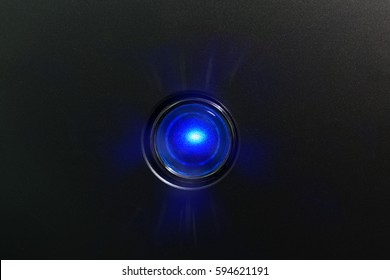 Blue Glowing Status Indicator, Warning Lamp Or Button, On Black Panel.