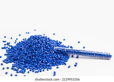blue granules of polypropylene, polyamide. White background. Plastic and polymer industry. Microplastic products.	
