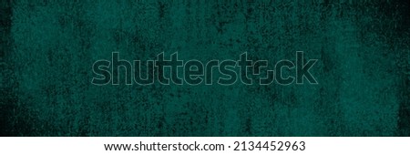 Blue green abstract rough background. Old dirty damaged painted wall. Dark teal background with copy space for design. Wide banner. Panoramic.