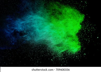 Blue And Green Powder Explosion On White Background. Paint Holi.