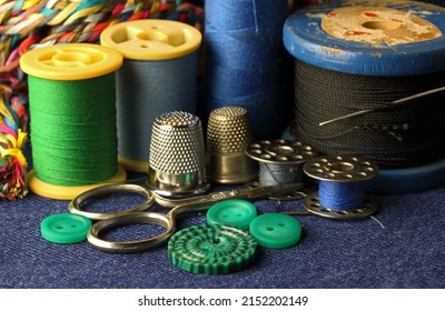 BLUE AND GREEN THREAD ON REELS WITH OLD WOODEN VINTAGE SPOOL WITH BLACK THREAD