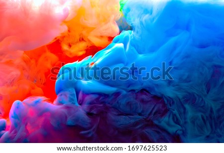 blue green yellow orange and pink colors melt in water