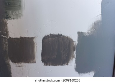 Blue Grey And Green Paint Swatches On A White Textured Wall