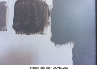 Blue Grey And Green Paint Swatches On A White Textured Wall