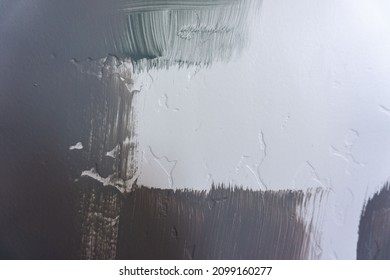 Blue Grey And Green Paint Swatches On A White Textured Wall