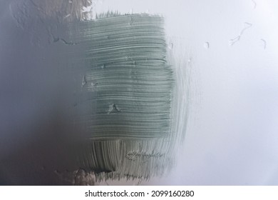 Blue Grey And Green Paint Swatches On A White Textured Wall