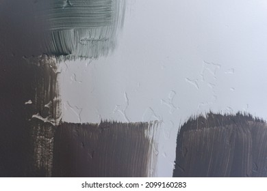 Blue Grey And Green Paint Swatches On A White Textured Wall