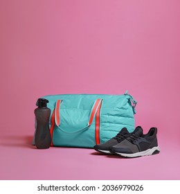 Blue Gym Bag And Sports Accessories On Pink Background