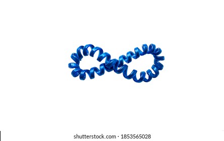 Blue Hair Ribbon Isolated On White Background. Close-up Of Coiled Hair Bands. Infinity Sign. Beautiful Hair Ties, Copy Space. View From Above