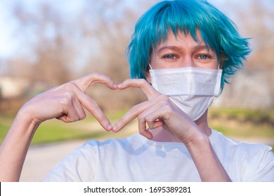 Blue Hair Young Woman Wearing A Medical Mask Shows The Heart Symbol Love To Fight And Strong Encourage Health Care From Covid 19