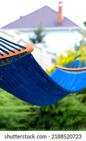 Blue Hammock Weighs In The Garden Green Lawn Summer House With A Chimney Next To It