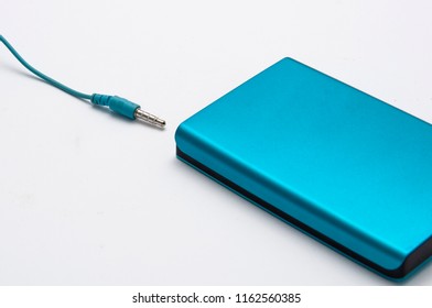 Blue hard disk with blue notebook white background / Work desk decor