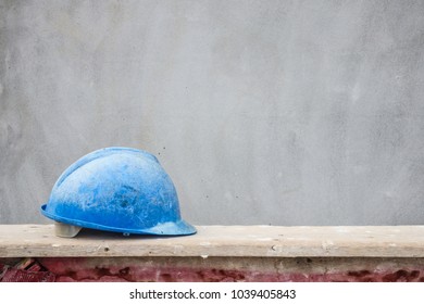 Blue Hard Hat On House Building Construction Site