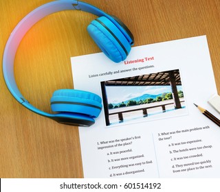 Blue Headphone And Listening English Test On Table