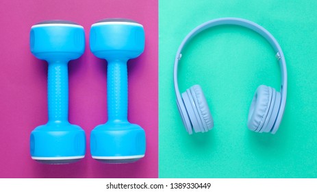 Blue headphones, plastic dumbbells on mint purple background. Sports with music. Flat lay. Top view. - Shutterstock ID 1389330449