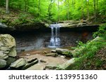 Blue Hen Falls, located in Cuyahoga Valley National Park, OH, is a small, tranquil falls.