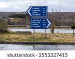 blue highway sign, route guidance sign, right and left direction arrows