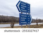 blue highway sign, route guidance sign, right and left direction arrows