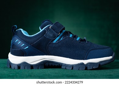 Blue Hiking Shoes For Kid On Green Background Horizontal Composition