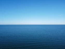 Blue Horizon Where The Cloudless Sky And The Blue Sea Converge.