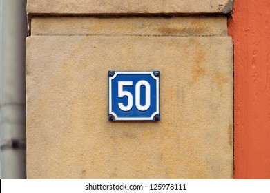 Blue House Number Fifty sign