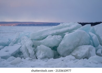Blue Ice Chunks view over Frozen Lake Michigan with beautiful Sky and Clouds at Sunset 