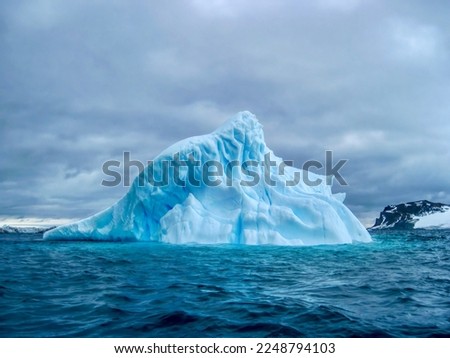 A blue iceberg drifting in the South Atlantic Ocean off the coast of South Georgia Island.