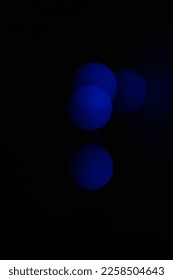 blue indigo bright and glowing circle bokeh light effect on black background - Shutterstock ID 2258504643