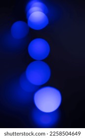 blue indigo bright and glowing circle bokeh light effect on black background - Shutterstock ID 2258504649