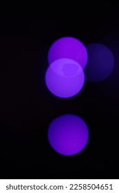 blue indigo bright and glowing circle bokeh light effect on black background - Shutterstock ID 2258504651