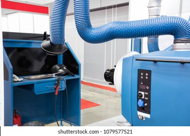 Blue Industrial Welding Equipment  Workshop With Welding Fume And Dust Extractor. Industrial Equipment Background
