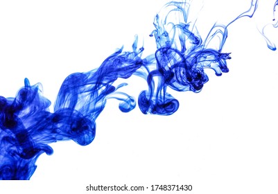 Blue ink injected into water from syringe, colour mixing with water creating abstract shapes, white background - Powered by Shutterstock