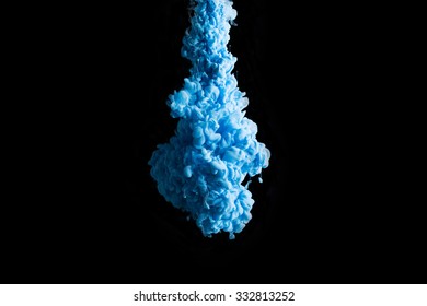 Blue Ink In Water On A Black Background. 