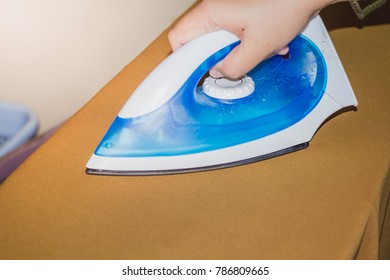 Blue iron with smooth fabric, brown cloth. - Shutterstock ID 786809665