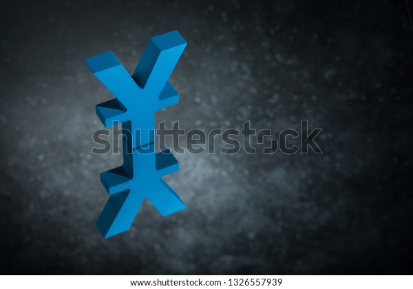 Blue Japanese of\
Chinese Currency Symbol Yen or Yuan With Mirror Reflection on Dark\
Dusty Background