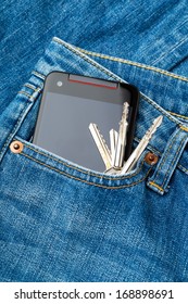 Blue jean pocket with mobile and door key
