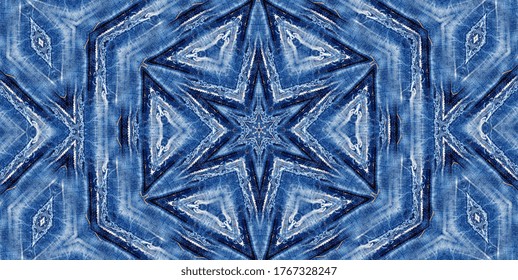 Blue jeans destroyed and torn with a patchwork pattern.
Denim fabric for youth best for background and fashion wallpaper. Repeating hand-embroidered star motif. Grunge or hippie style.